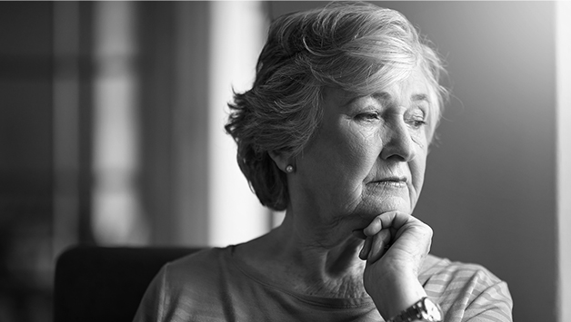 senior woman leaning her chin on her fist