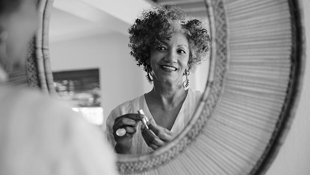 woman looking in a mirror