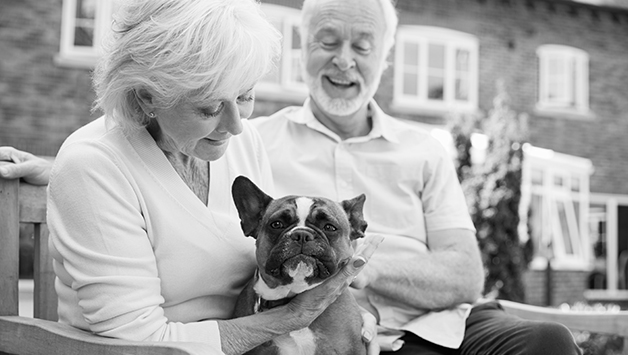 senior woman and man with dog