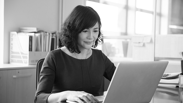 woman writing on laptop