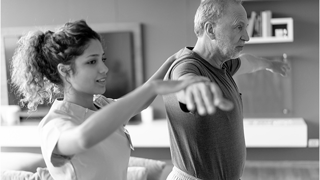 physical therapist assisting patient