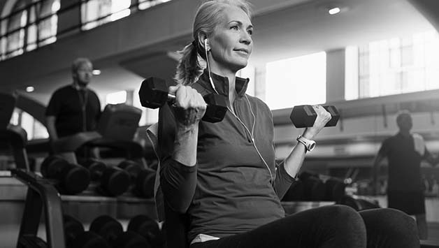 senior woman lifting dumbbells