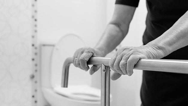 person holding bar in bathroom