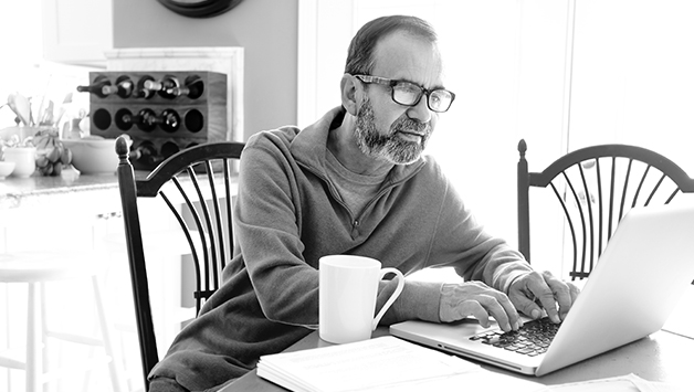 man typing on laptop